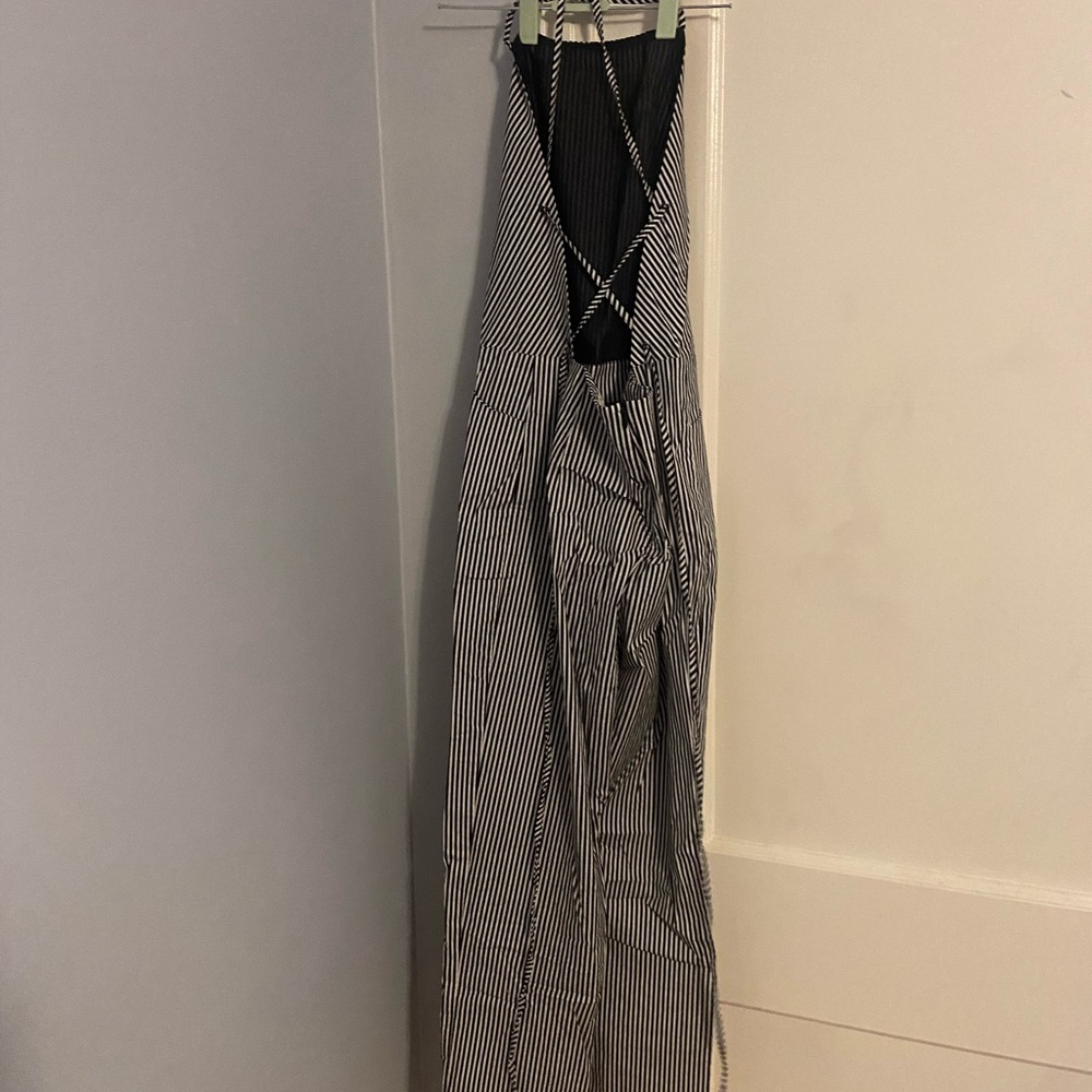 Urban Outfitters - Silence + Noise . black and white stripped jumpsuit. Size M